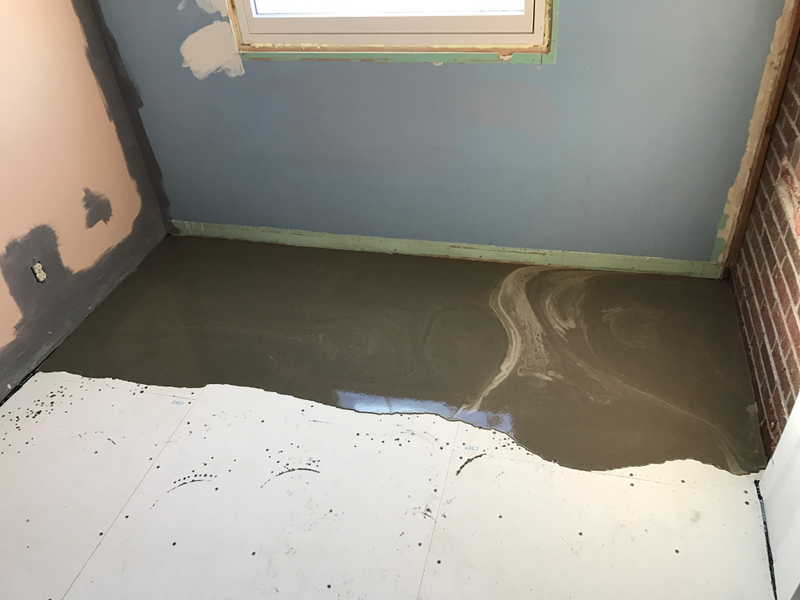 So we discovered that this end of the kitchen was about an inch lower than the rest. A couple buckets of self-leveling cement later and it’s fine.